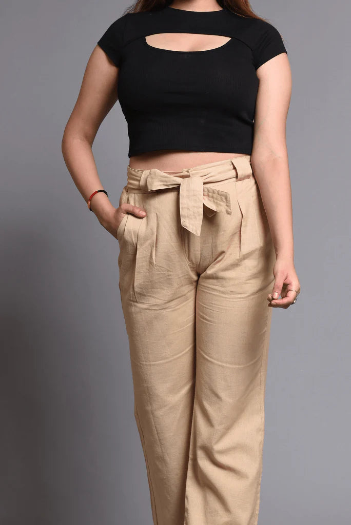 Women wearing cream wide leg linen trousers