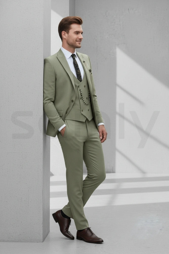 Elegant sage green three-piece suit giving men a sharp wedding look-side