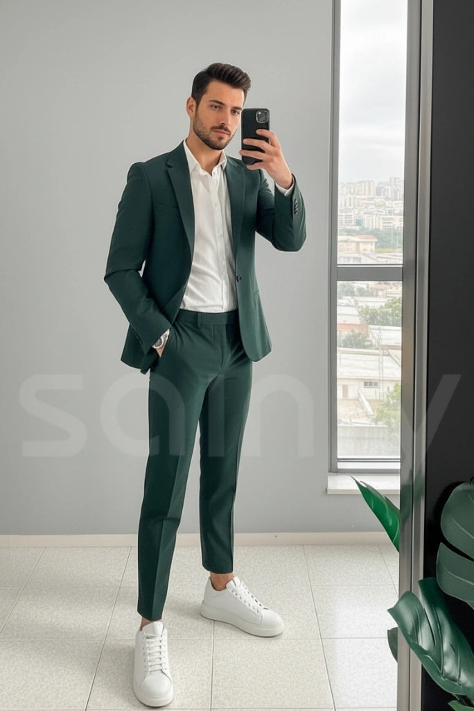 Men dressed in teal green suit with clean minimal styling-front