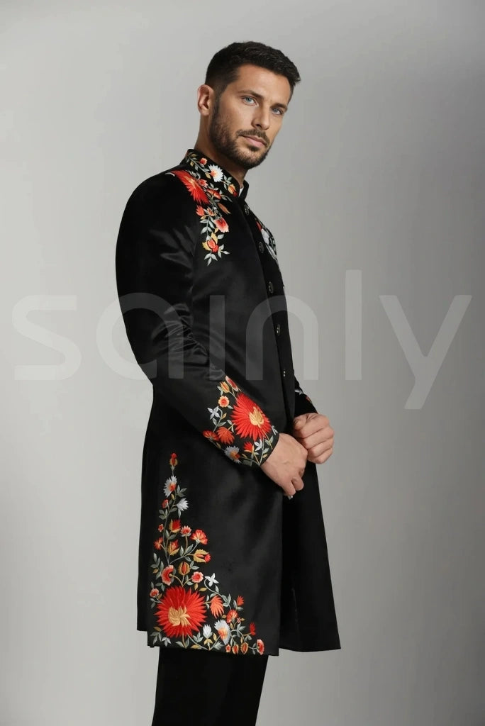 Black sherwani showcasing exquisite floral threadwork