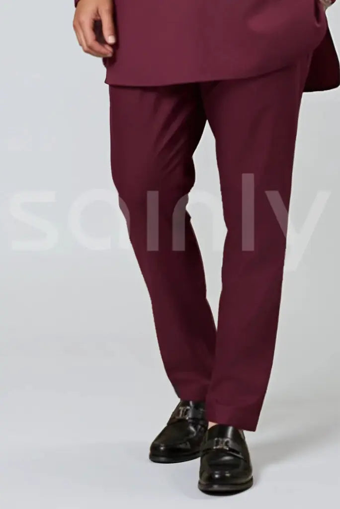 Stylish maroon men's ethnic kurta set with minimalist button detailing.