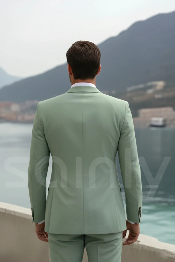 Slim-fit sage green suit styled for modern festive celebrations-back