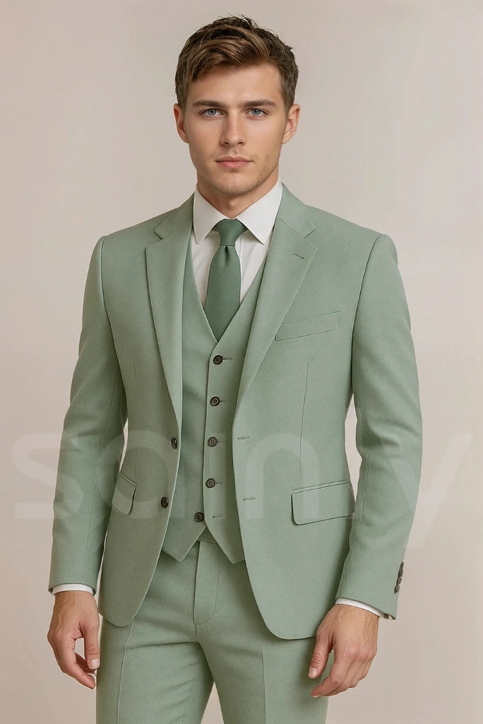 Sage green men's suit worn for a garden party or daytime formal event-front