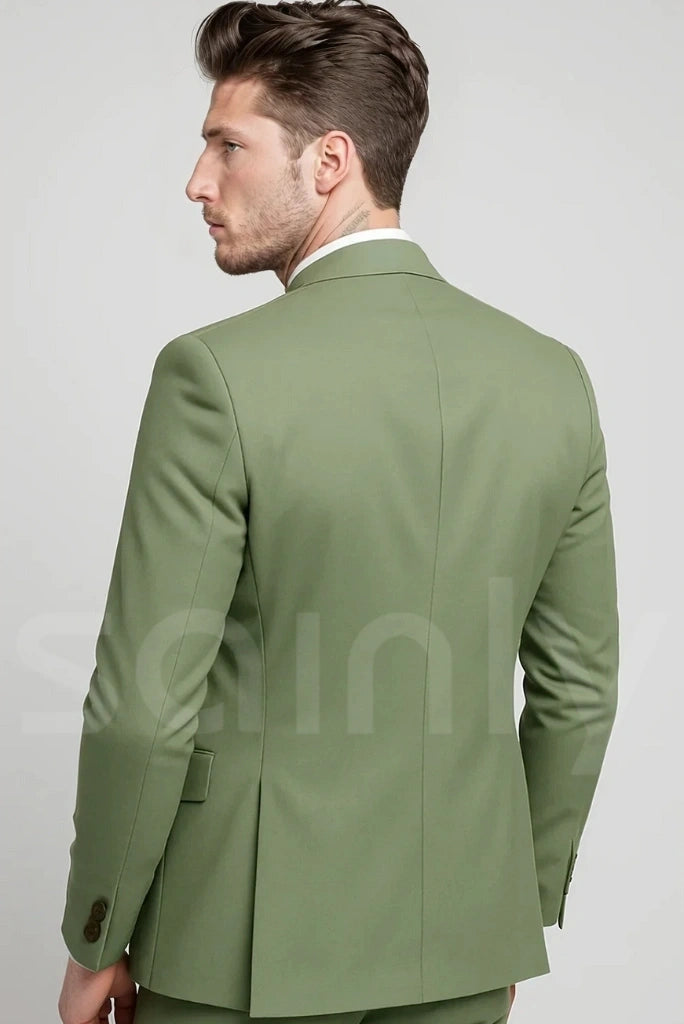Tailored sage green suit, ideal for a spring wedding or outdoor celebration-back