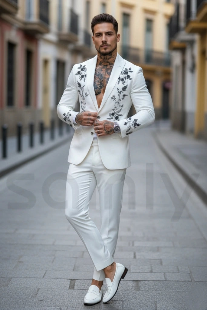 White embroidered groom suit with front and sleeve work