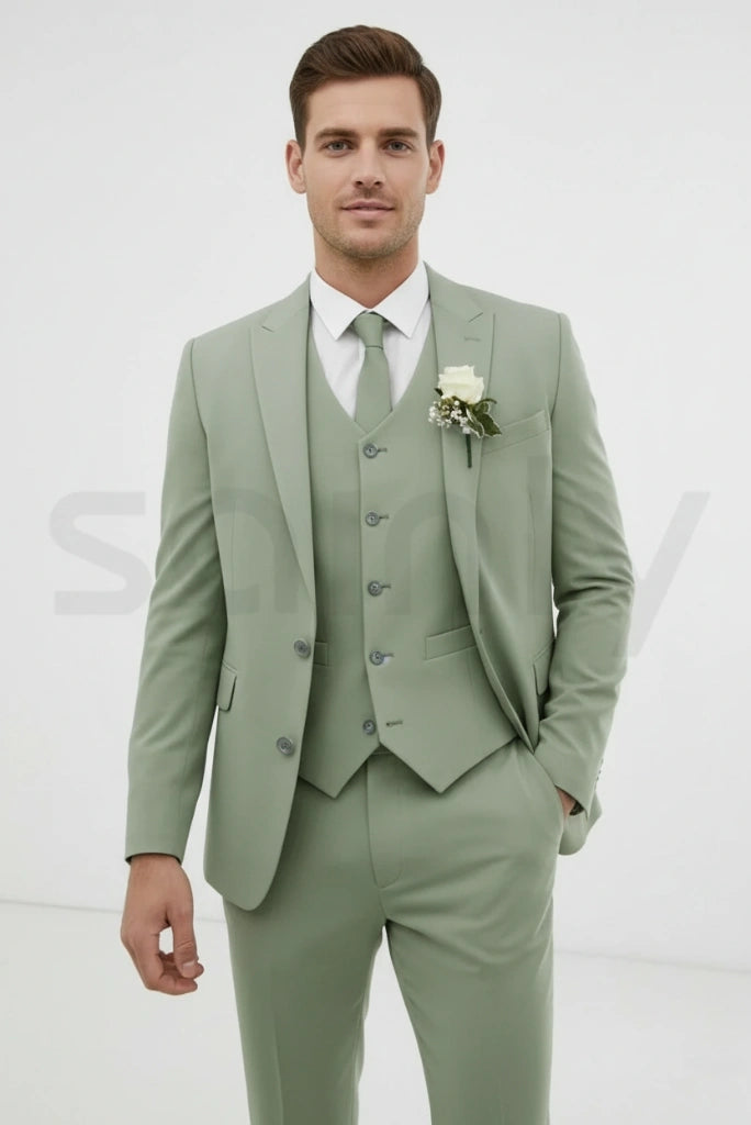 Men dressed in sage green three-piece suit with refined wedding look-front